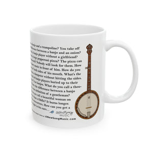 White mug with banjo illustration and banjo jokes text on a white background